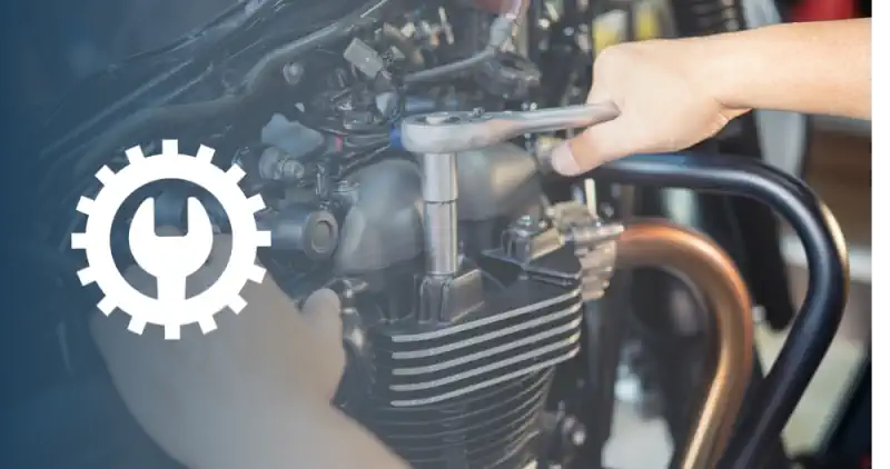 mechanic woriking with socket wrench