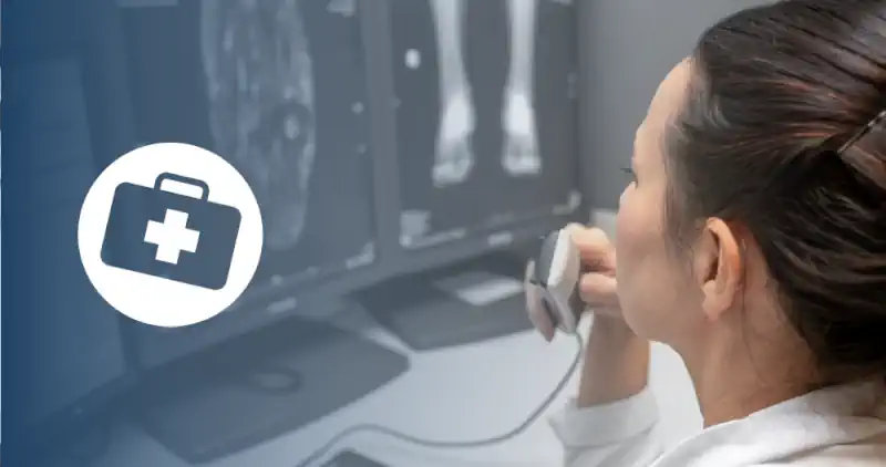 a radiologic tech observing medical images on screens