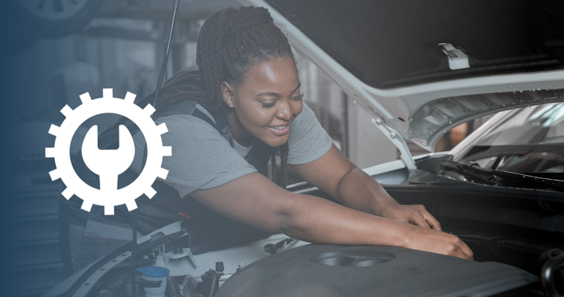 woman working on a hybrid vehicle