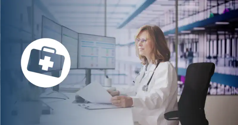 medical coder working at a computer
